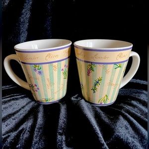 Two coffee or tea mugs with herbs decoration.